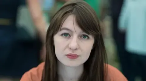 Irish author Sally Rooney claims she will not travel to the UK over legal concerns